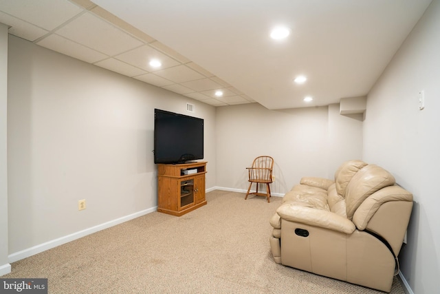 sitting room with visible vents, baseboards, carpet floors, recessed lighting, and a paneled ceiling