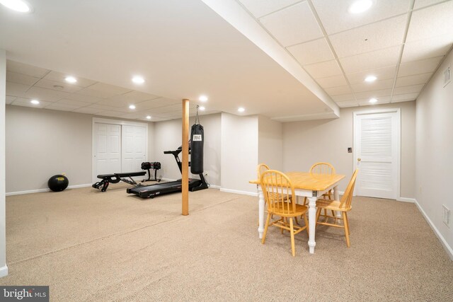 interior space featuring recessed lighting, a paneled ceiling, and baseboards