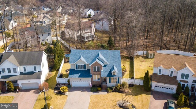 birds eye view of property with a residential view