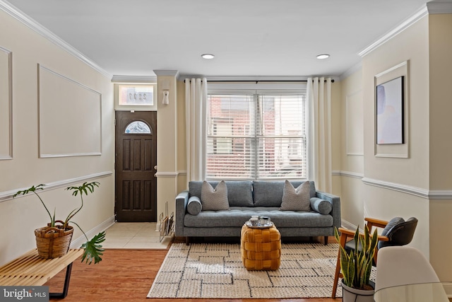 living room featuring baseboards, recessed lighting, light tile patterned flooring, and crown molding