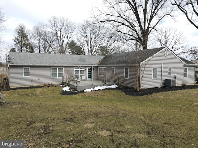 back of property featuring central AC unit, a lawn, and a patio area