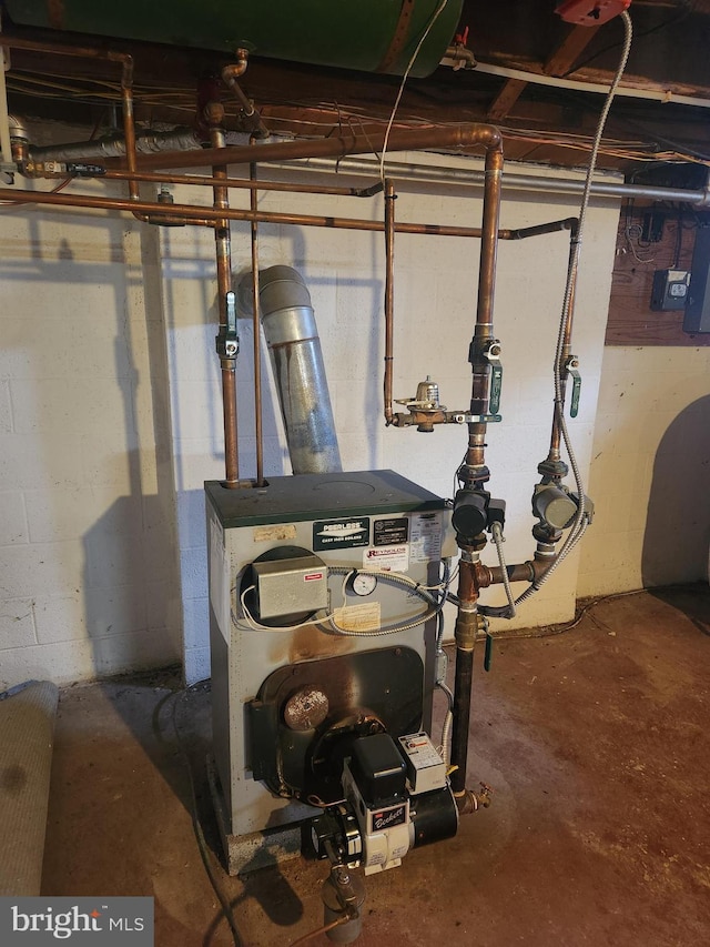 utility room featuring a heating unit