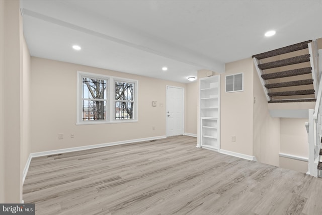 interior space with recessed lighting, wood finished floors, visible vents, baseboards, and stairs