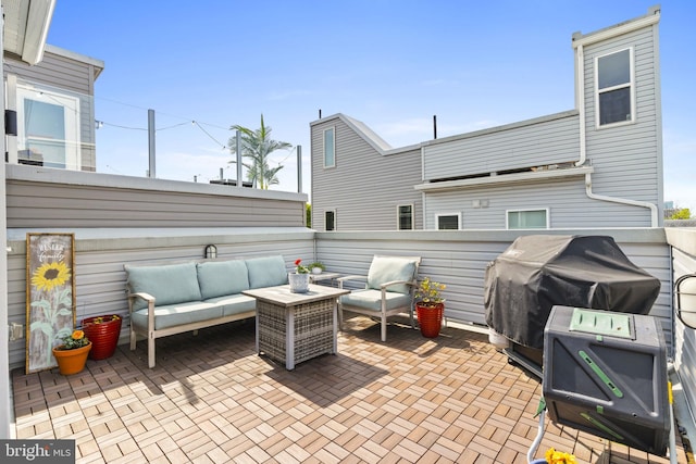 view of patio with a grill and outdoor lounge area