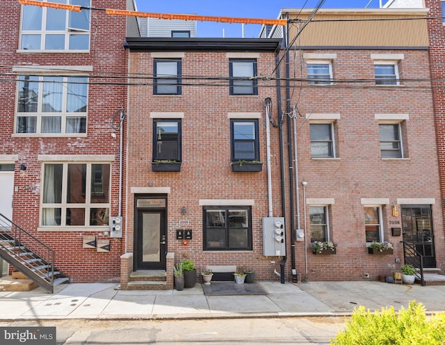 view of front of house with brick siding