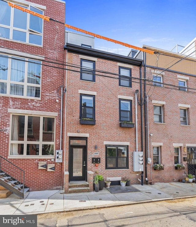 view of front of property featuring brick siding