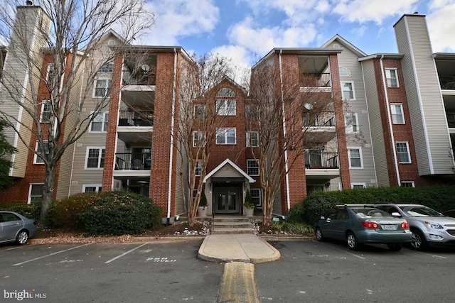 view of property featuring uncovered parking