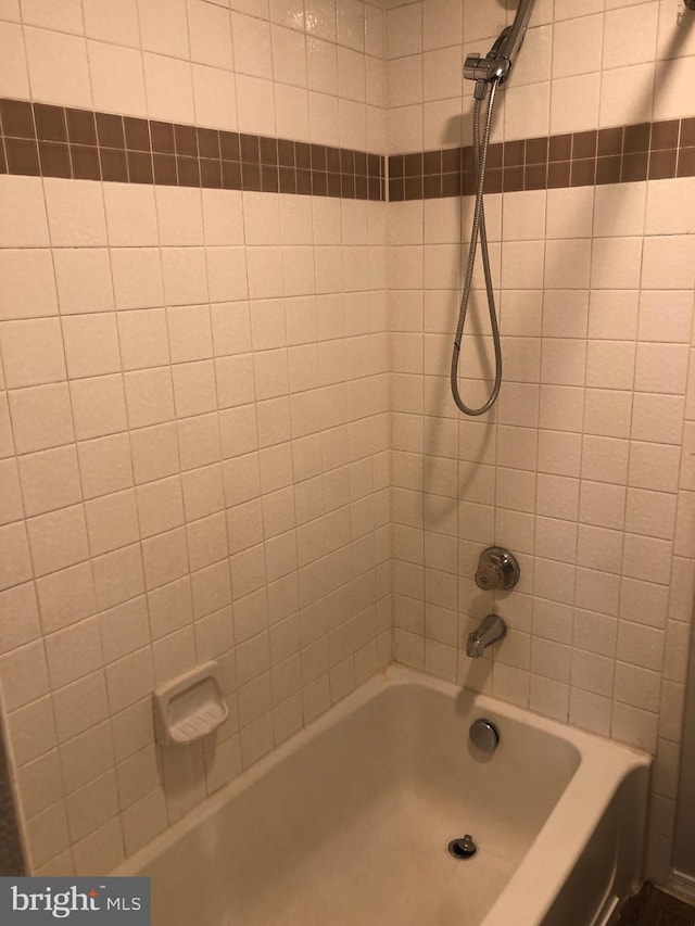 bathroom with shower / bathing tub combination