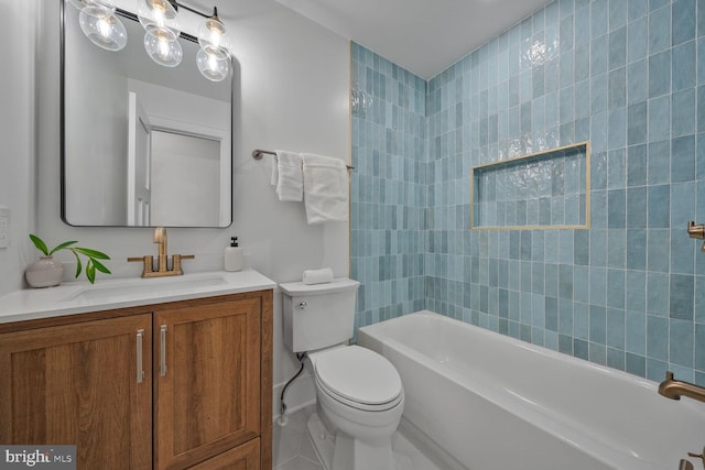 bathroom featuring toilet, shower / washtub combination, and vanity