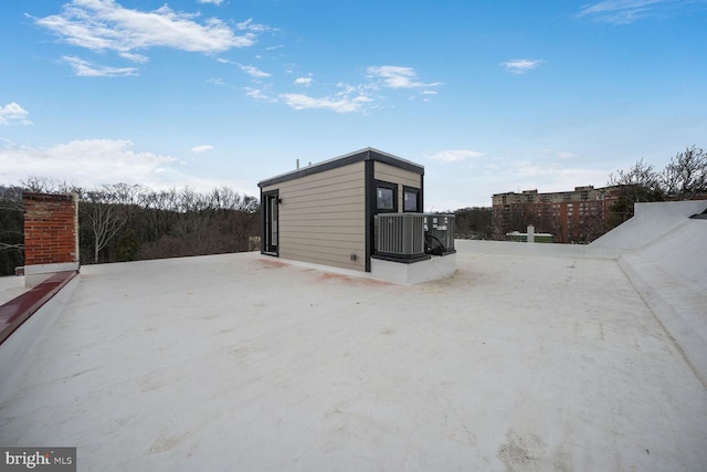 view of outbuilding with central AC unit and an outdoor structure