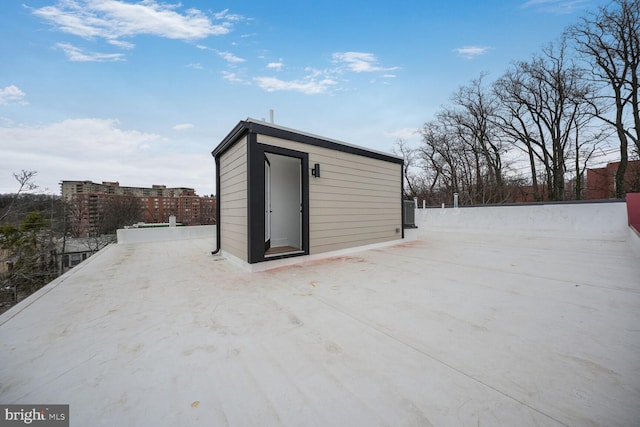 view of shed with fence