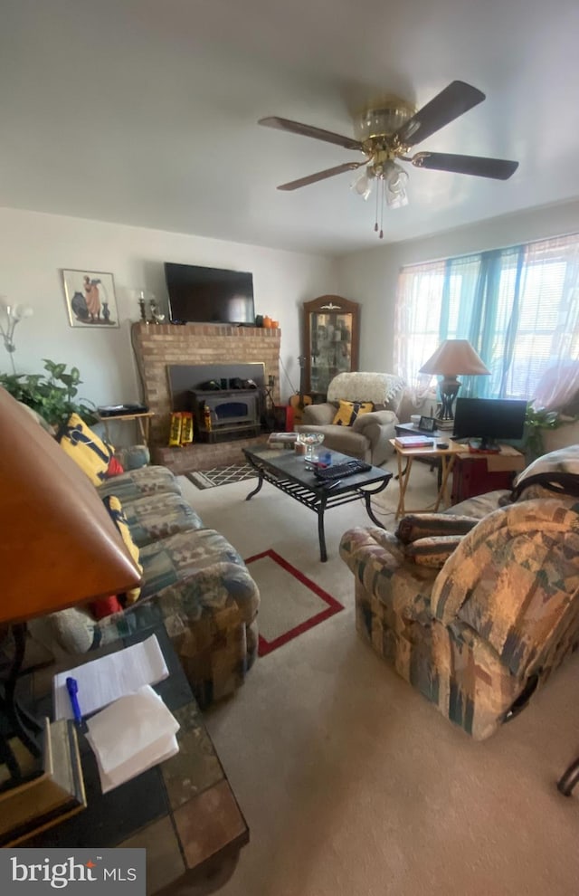 living room featuring ceiling fan and carpet flooring