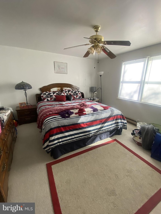 carpeted bedroom featuring a ceiling fan