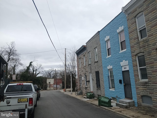 view of street with curbs