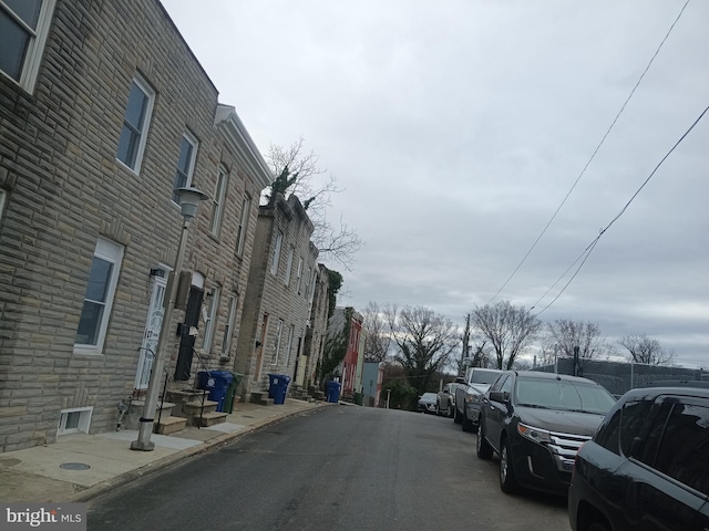 view of road featuring curbs and sidewalks