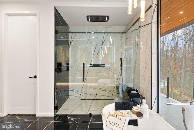 full bath with marble finish floor, a marble finish shower, and recessed lighting