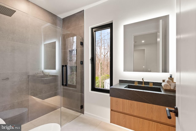 full bathroom with toilet, a stall shower, tile patterned floors, and vanity