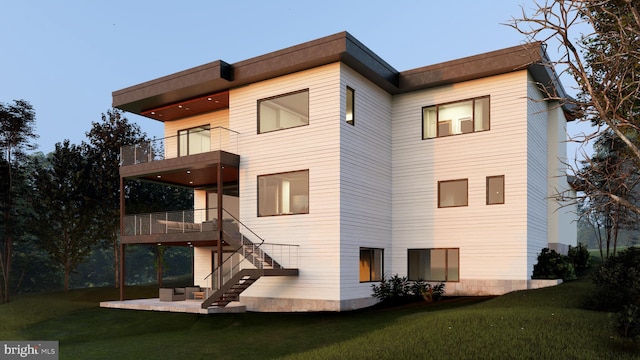 rear view of house featuring a patio, a lawn, a balcony, and stairs