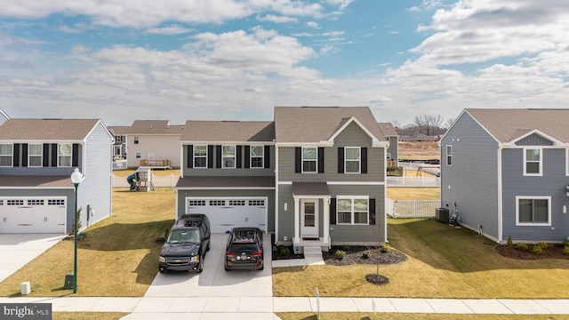 view of front of property featuring driveway, a garage, a residential view, central air condition unit, and a front lawn