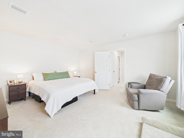 bedroom with light colored carpet and visible vents