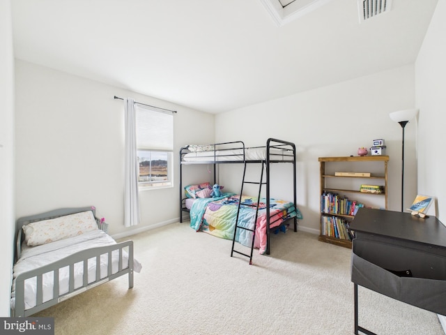 carpeted bedroom with visible vents and baseboards