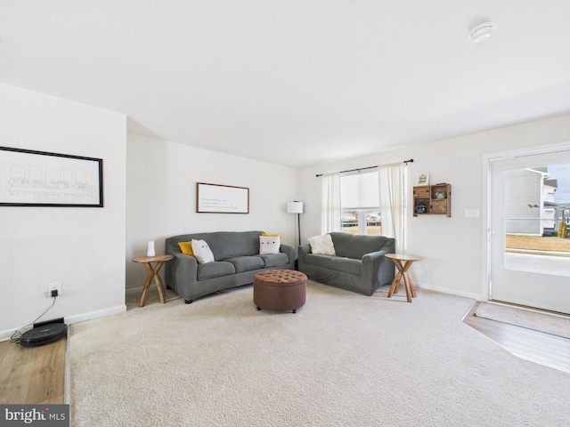 living area featuring baseboards