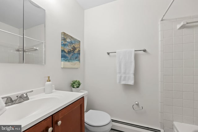 bathroom with vanity, toilet, and baseboard heating