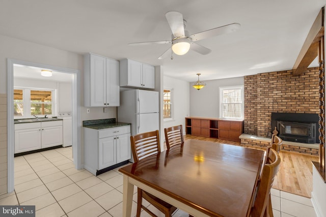 dining room featuring light tile patterned floors and ceiling fan