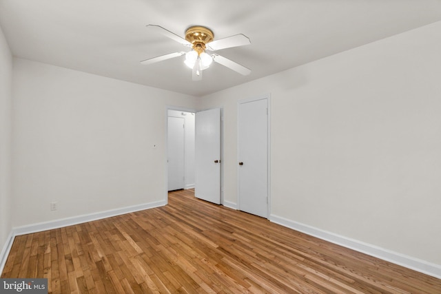 unfurnished bedroom with baseboards, light wood finished floors, and ceiling fan