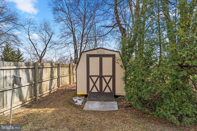 view of shed featuring fence