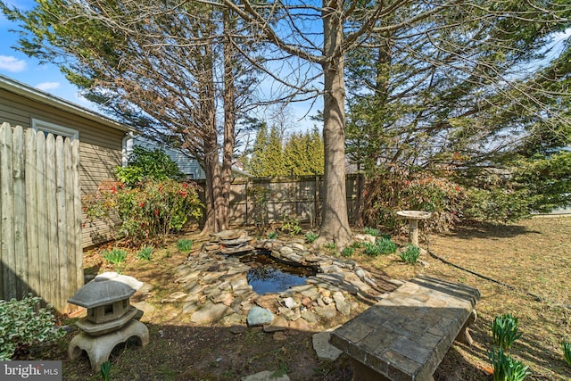 view of yard with fence