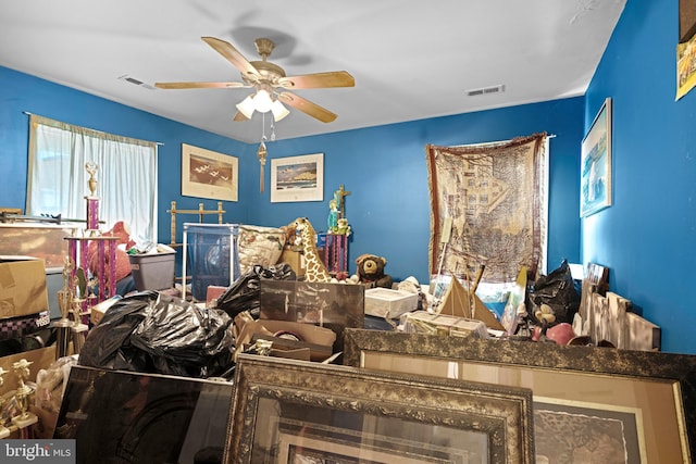 bedroom featuring visible vents and a ceiling fan