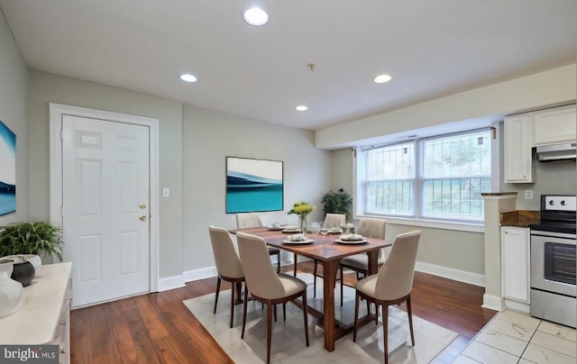 dining area featuring wood finished floors, recessed lighting, and baseboards