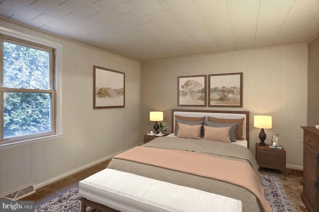 bedroom with multiple windows, carpet, visible vents, and baseboards