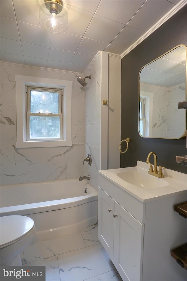 bathroom featuring washtub / shower combination, marble finish floor, vanity, and toilet