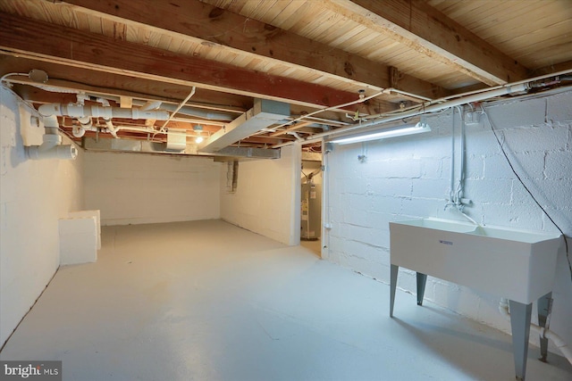 unfinished basement with water heater