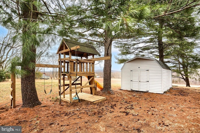 view of jungle gym featuring a shed and an outdoor structure