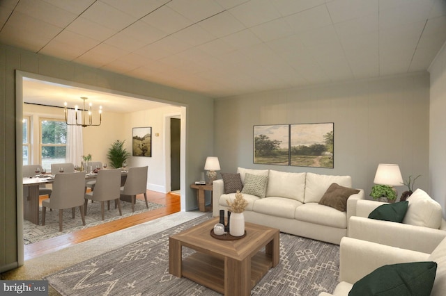 living room featuring an inviting chandelier and wood finished floors