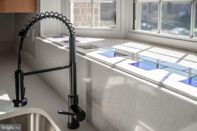 interior details featuring tile countertops