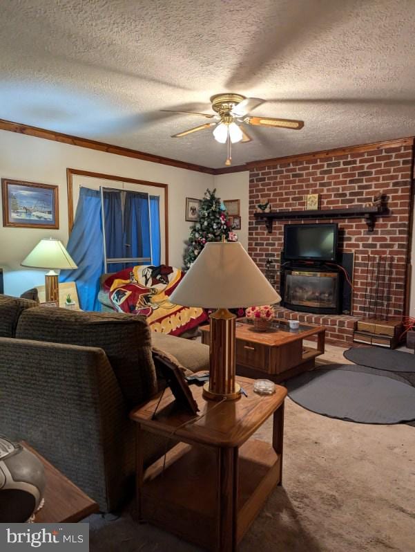 carpeted living room featuring ceiling fan, ornamental molding, and a textured ceiling