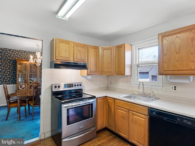 kitchen featuring dishwasher, stainless steel electric range, light countertops, under cabinet range hood, and a sink