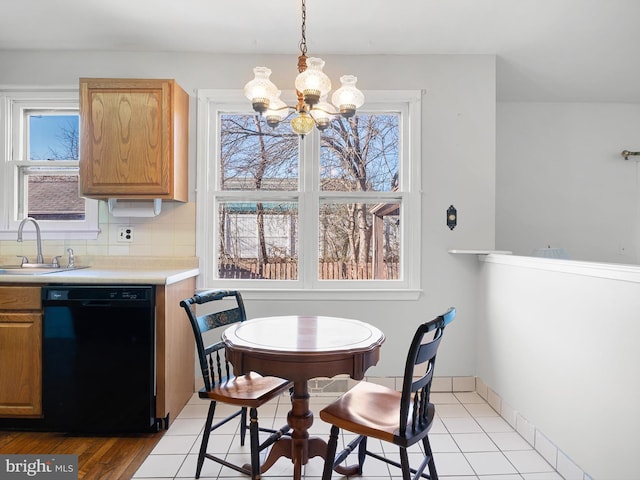 dining area featuring a notable chandelier and baseboards