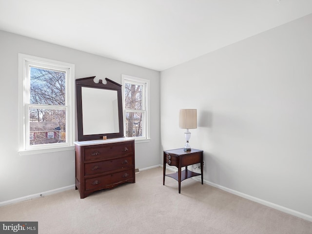 sitting room with light carpet and baseboards