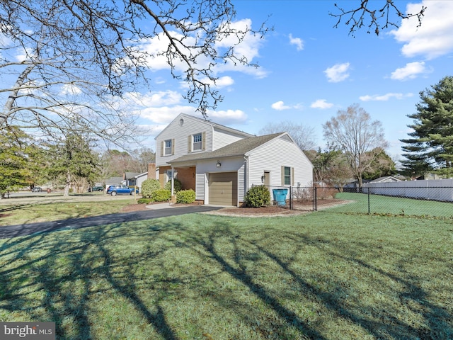 view of front facade featuring aphalt driveway, a garage, a front lawn, and fence