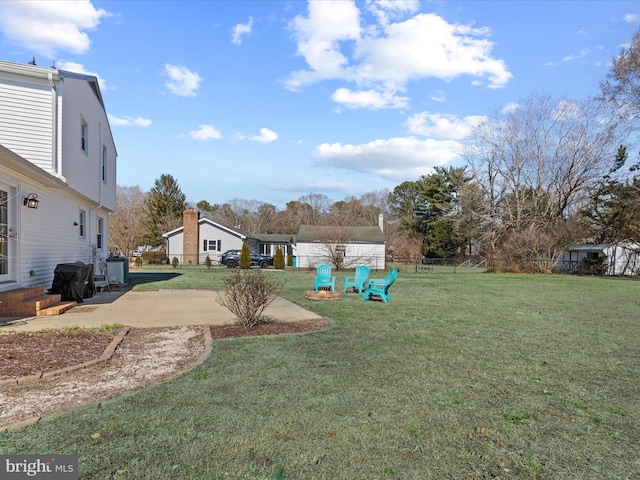 view of yard featuring a patio area, entry steps, and fence