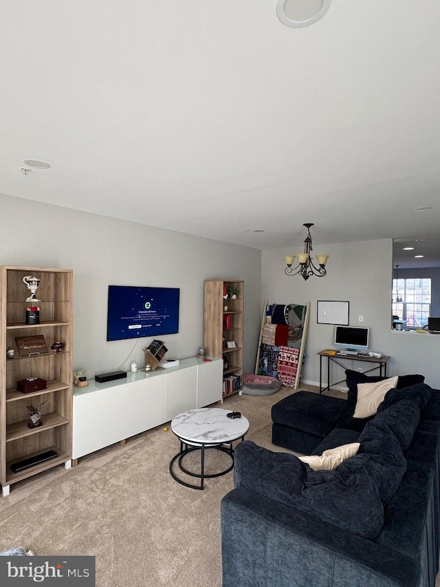 living room featuring carpet floors and a chandelier