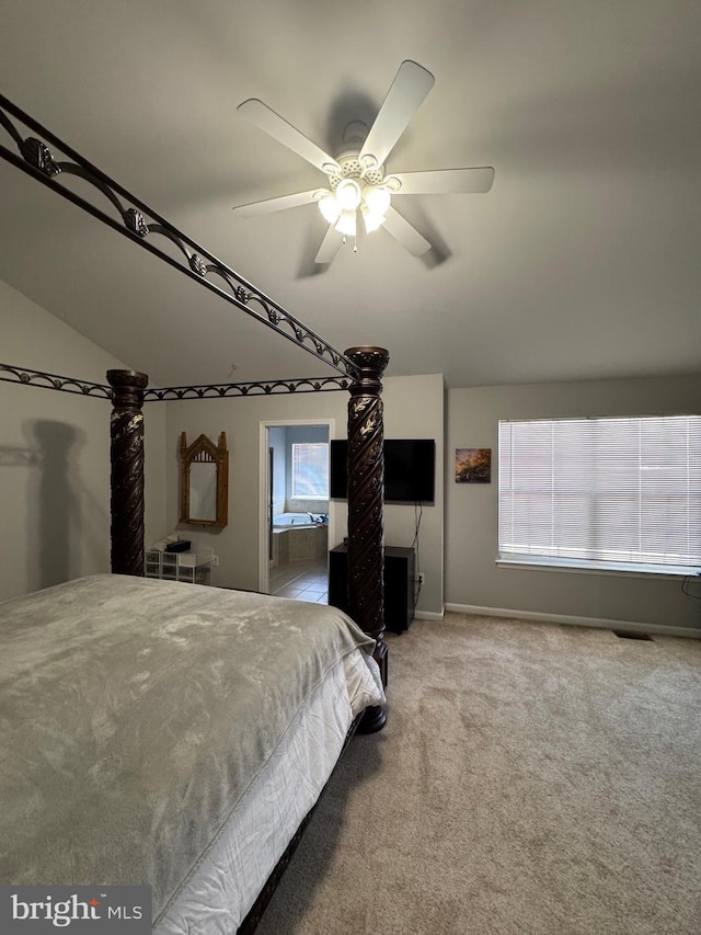 bedroom with visible vents, connected bathroom, ceiling fan, and carpet floors