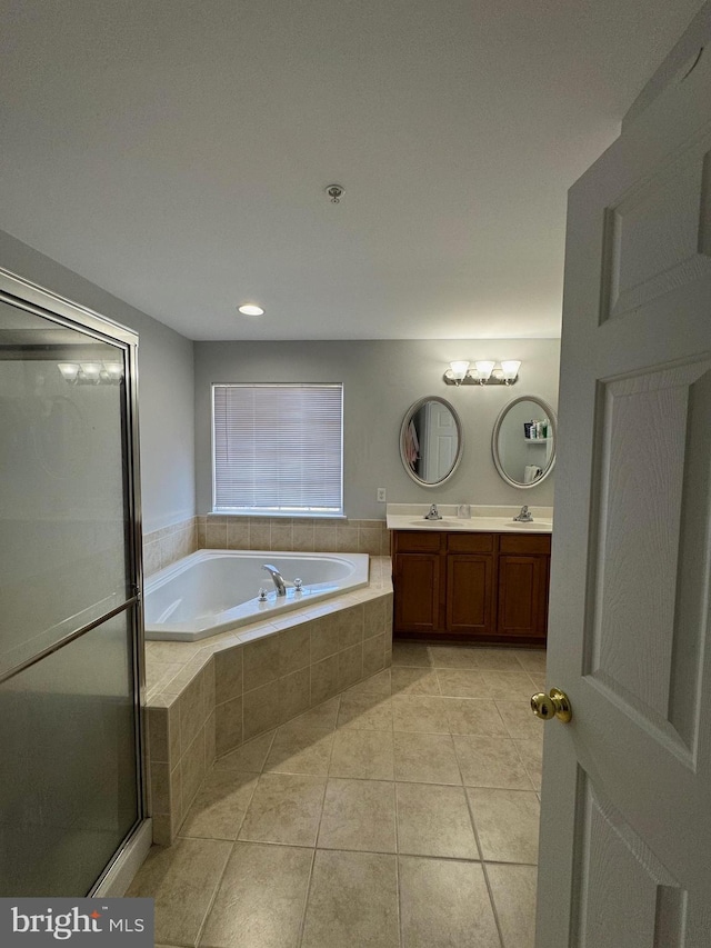 full bathroom with a shower with door, a garden tub, double vanity, tile patterned floors, and a sink