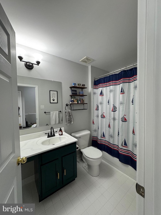 bathroom featuring vanity, a shower with shower curtain, visible vents, tile patterned floors, and toilet