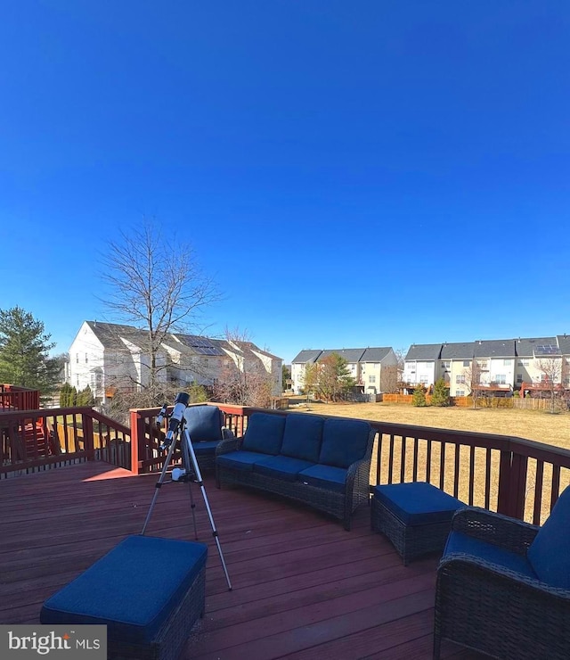 deck featuring a residential view and an outdoor hangout area